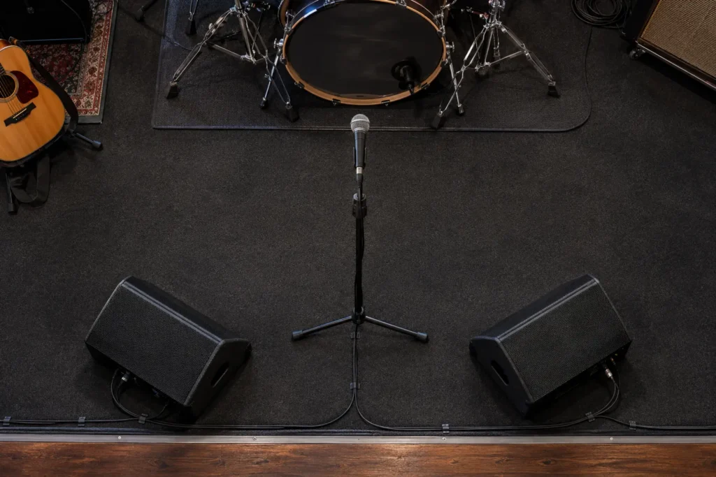 Overhead view of a mic stand with two wedge monitors angled in from the left and right